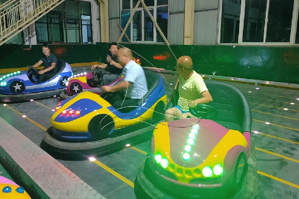 Adults Are Driving Electric Bumper Cars in Dinis Factory